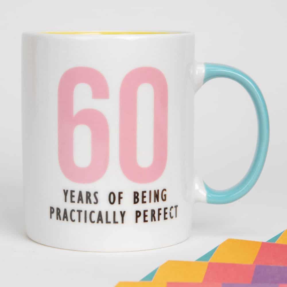Wish someone special a happy birthday with this 60 YEARS OF BEING PRACTICALLY PERFECT porcelain mug. From Oh Happy Day!
